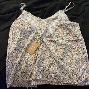 Never worn. Size large. The back is an open V with lace